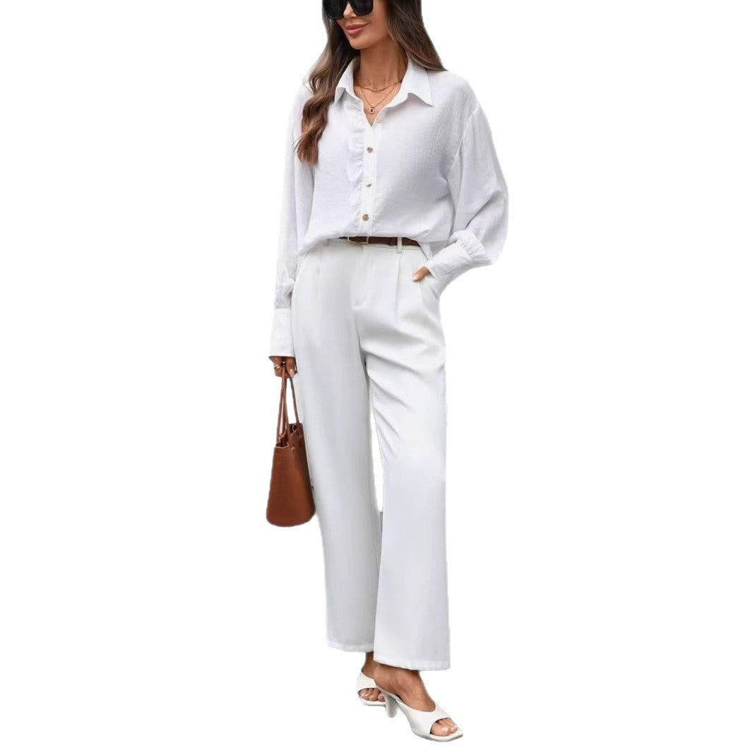 قميص بأكمام طويلة بلون موحد مع تفاصيل أزرار أمامية