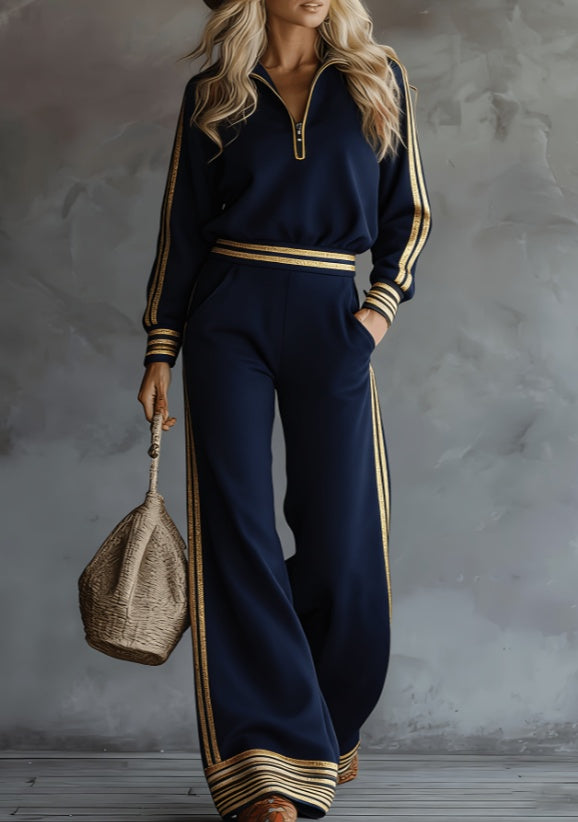 طقم مكون من قطعتين: سويت شيرت مخطط بياقة عالية وسحاب نصفي وبنطال واسع الساقين من بنوم بنه