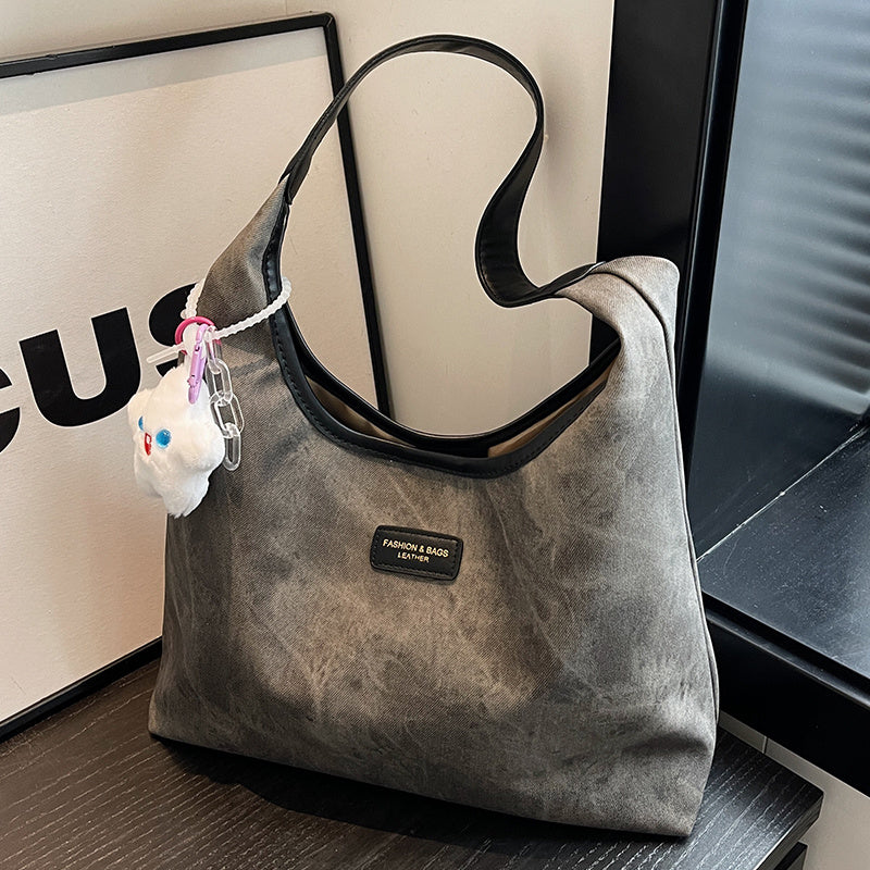 Sac cabas demi-lune en jean et toile avec fermeture éclair