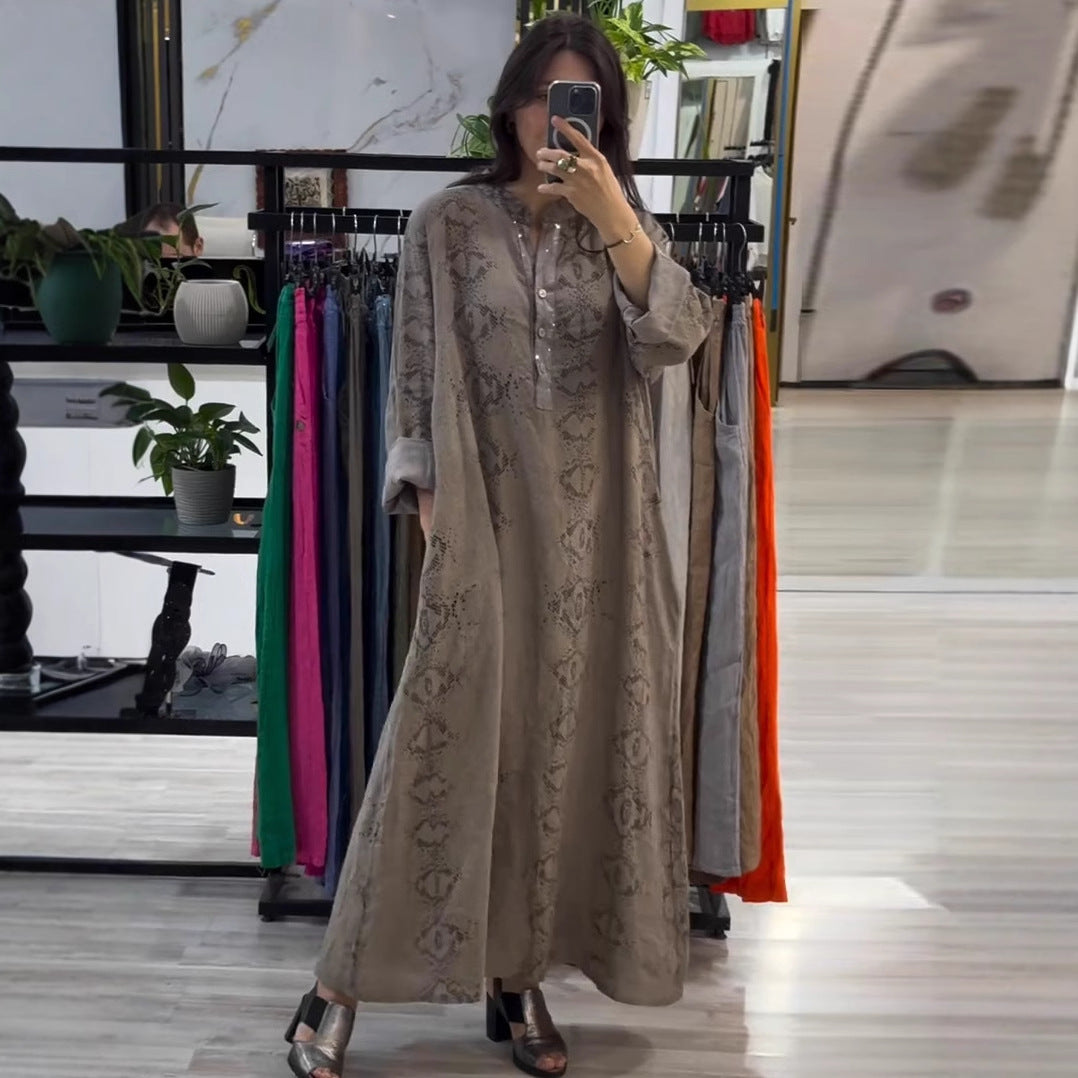 فستان نسائي أنيق بأكمام طويلة ومزيّن بالترقيع