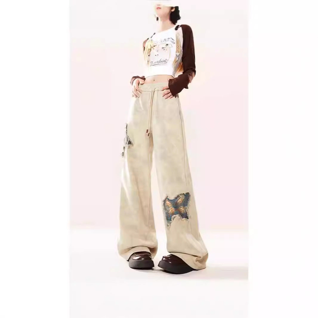 Pantalon en jean évasé abricot brodé papillon américain pour femme