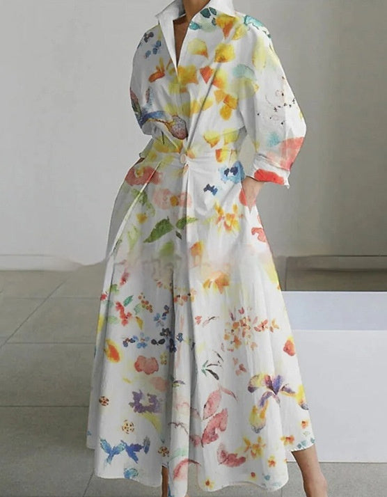 Robe mi-longue en coton à col montant, taille cintrée et imprimé poche
