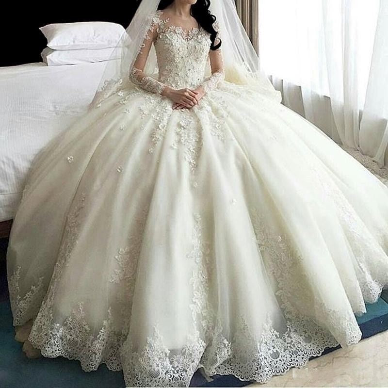 Robe de mariée princesse sexy à manches longues et dos boutonné