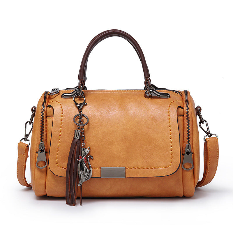 Sac bandoulière rétro Boston en PU avec pompon 27x15x18cm