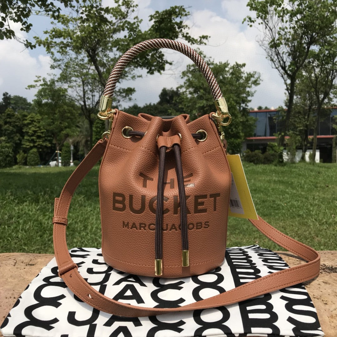 Sac bandoulière en cuir de vachette à cordon de serrage petit sac à main de couleur unie pour femmes
