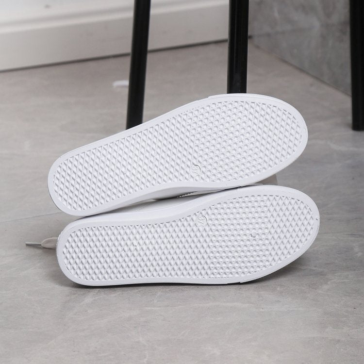 Chaussures plates décontractées à lacets et bout rond blanc