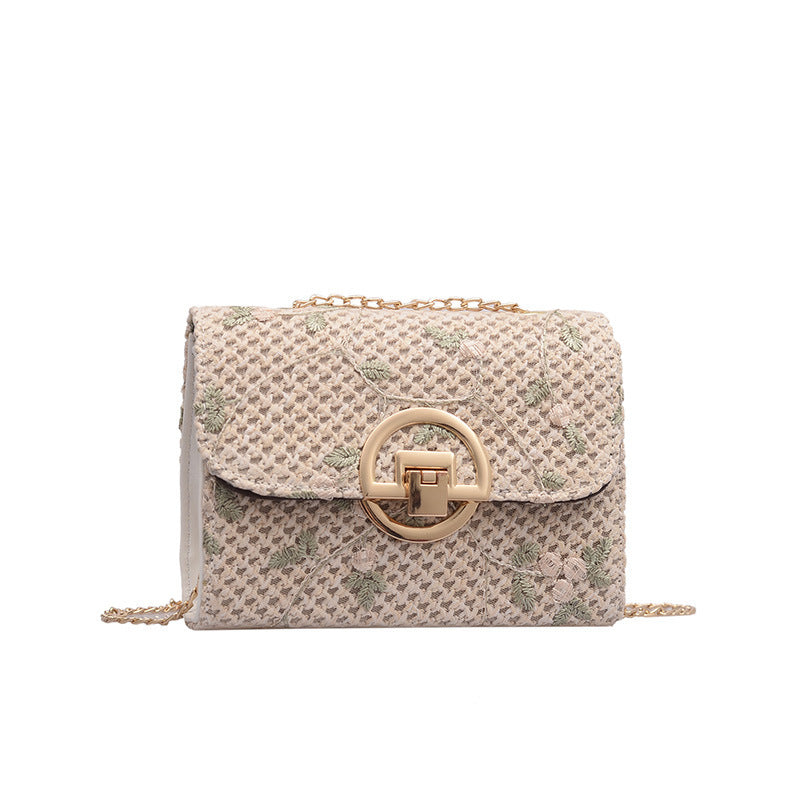 Petit sac en paille brodé à bandoulière fine