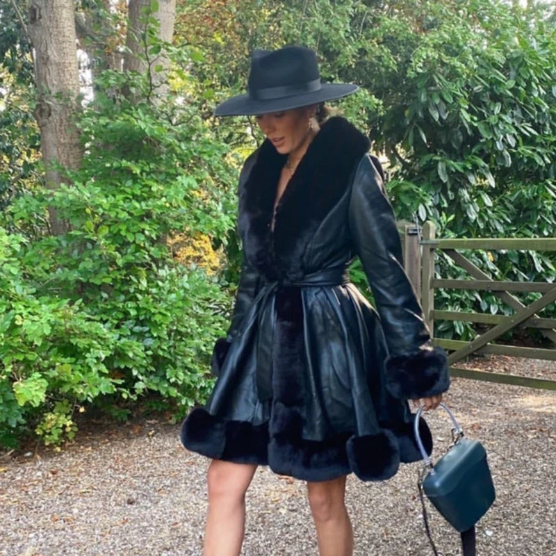 Fur coat with lotus leaf hem and faux leather belt