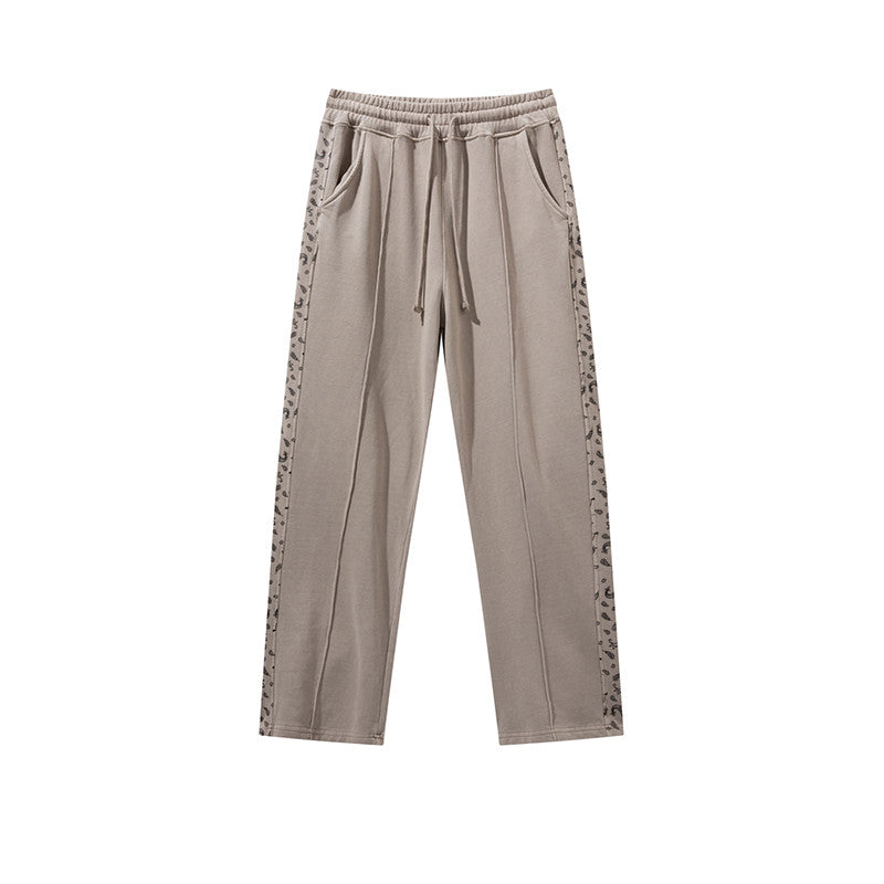 Pantalon à cordon de serrage, effet usé, coupe droite ample, style décontracté.