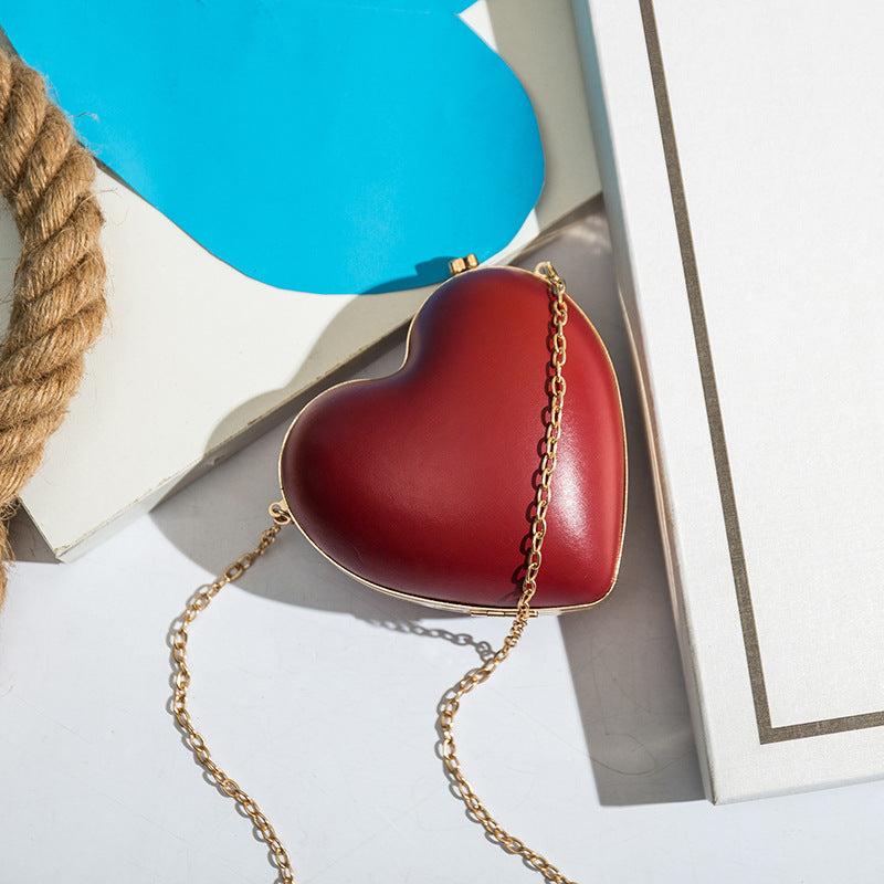 Red Mini Heart-Shaped Shoulder Bag with Chain Lock Closure