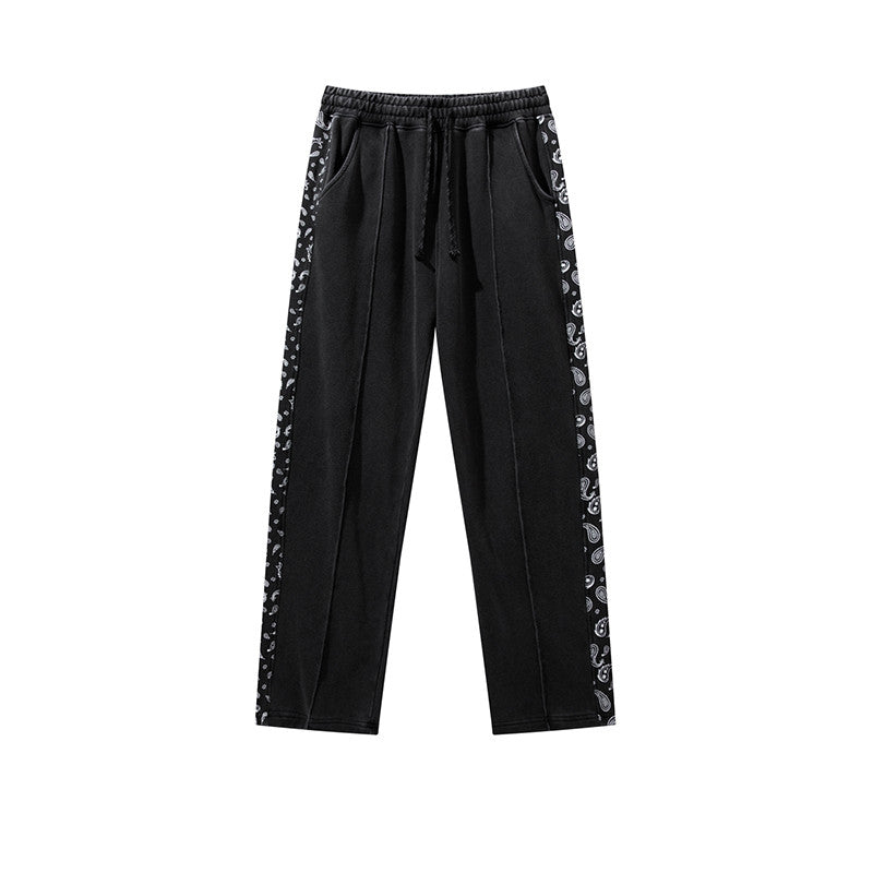 Pantalon à cordon de serrage, effet usé, coupe droite ample, style décontracté.
