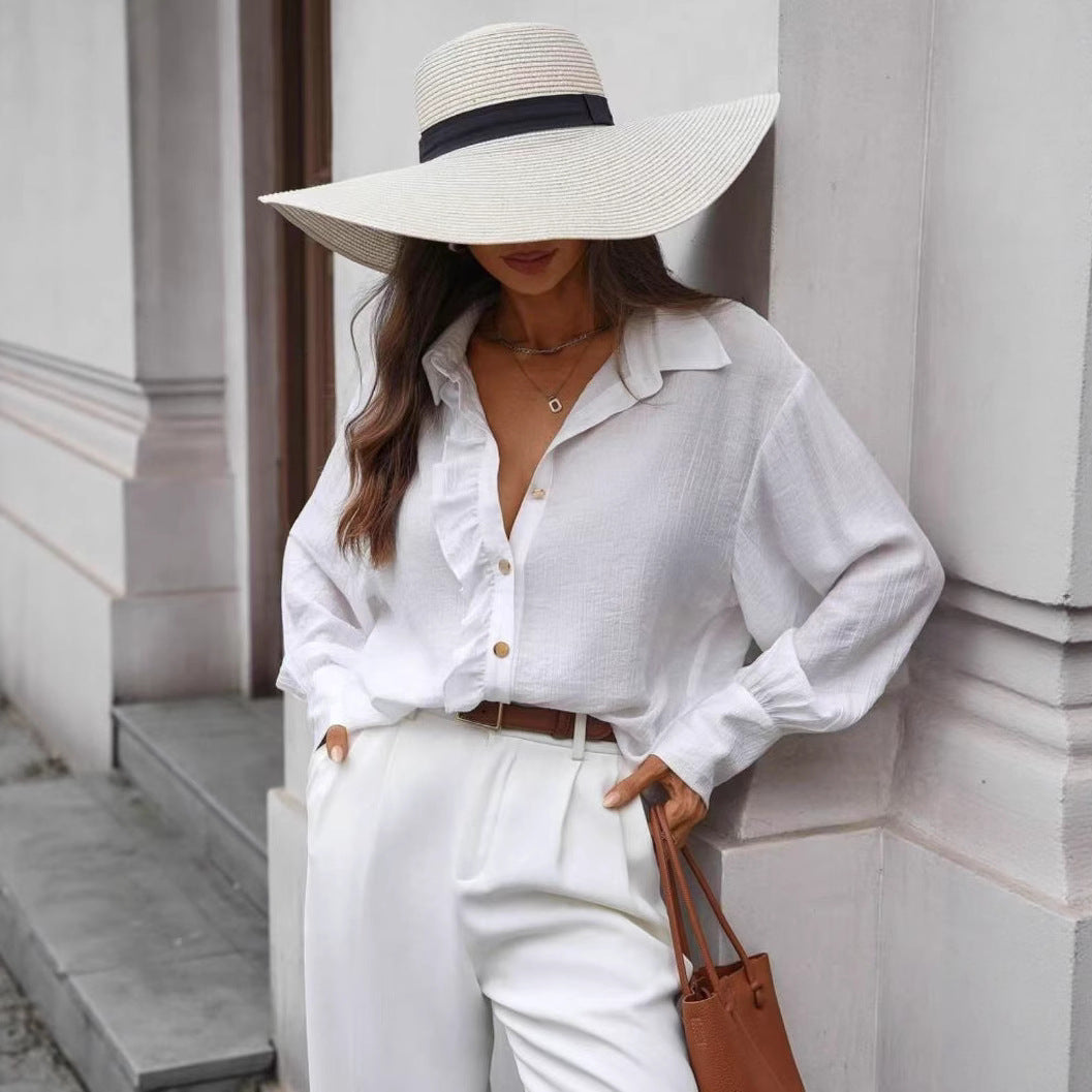 قميص بأكمام طويلة بلون موحد مع تفاصيل أزرار أمامية