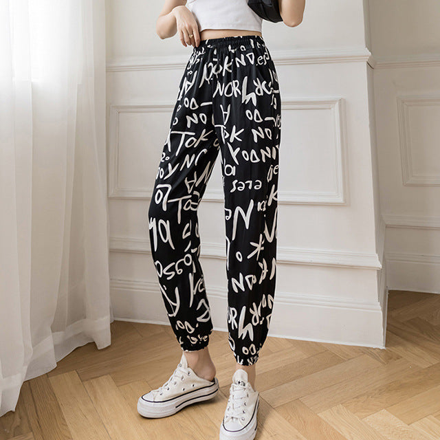 Pantalon de jogging taille haute en soie glacée, motif peinture à l'encre tie-dye