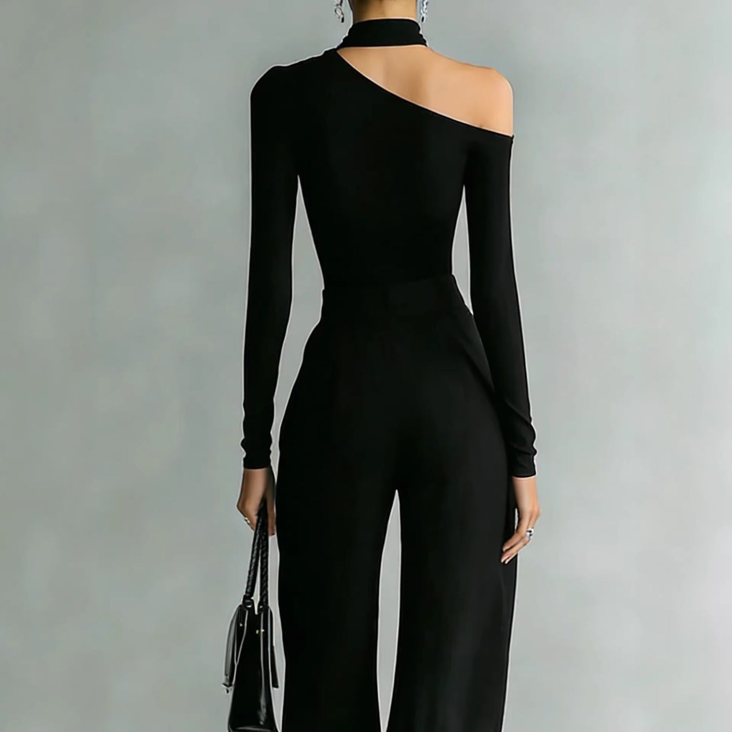 طقم بنطال واسع الساقين، بياقة دائرية وأكمام طويلة، مصنوع من قماش محبوك، مزود بسحاب ثنائي الاتجاه.