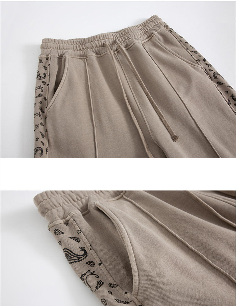 Pantalon à cordon de serrage, effet usé, coupe droite ample, style décontracté.