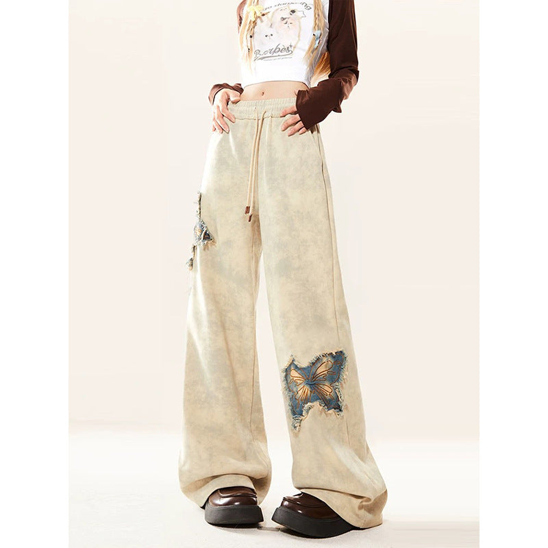 Pantalon en jean évasé abricot brodé papillon américain pour femme