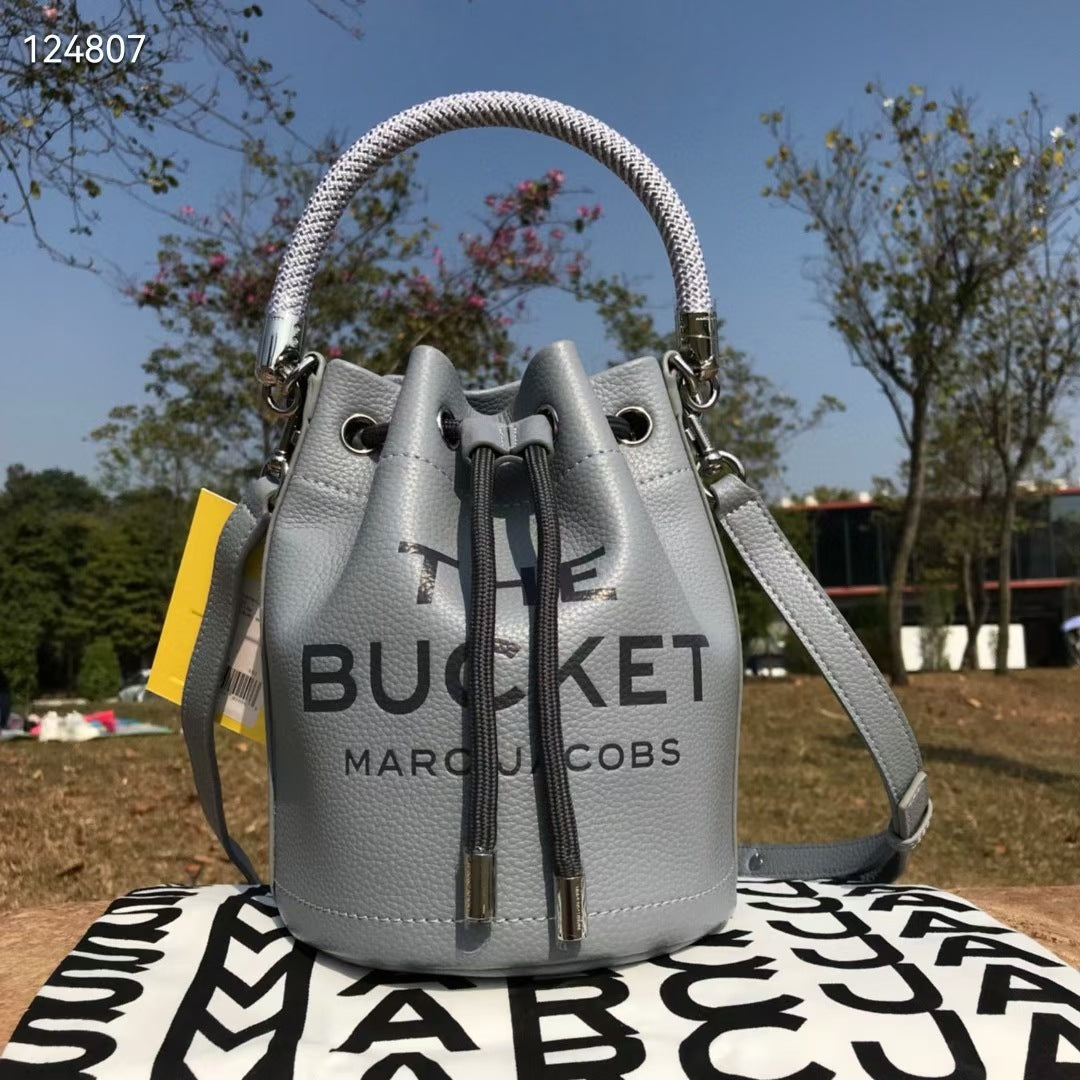 Sac bandoulière en cuir de vachette à cordon de serrage petit sac à main de couleur unie pour femmes