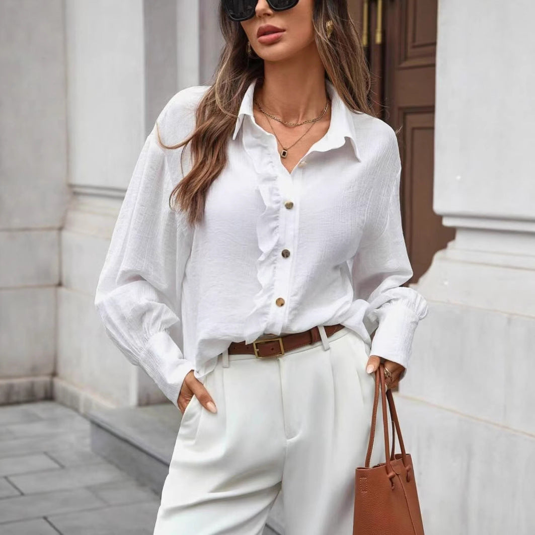 قميص بأكمام طويلة بلون موحد مع تفاصيل أزرار أمامية