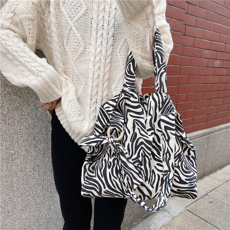 Sac messager rétro grande capacité avec motif rose artistique