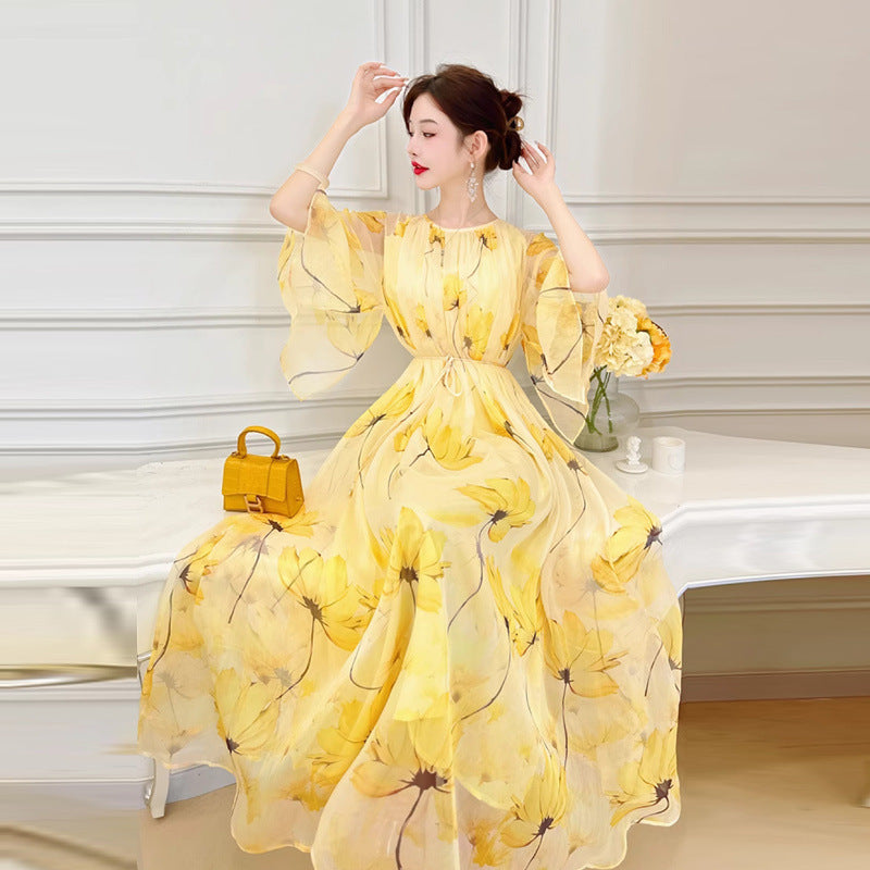 Robe en mousseline française fluide et polyvalente à motif floral jaune pour femme