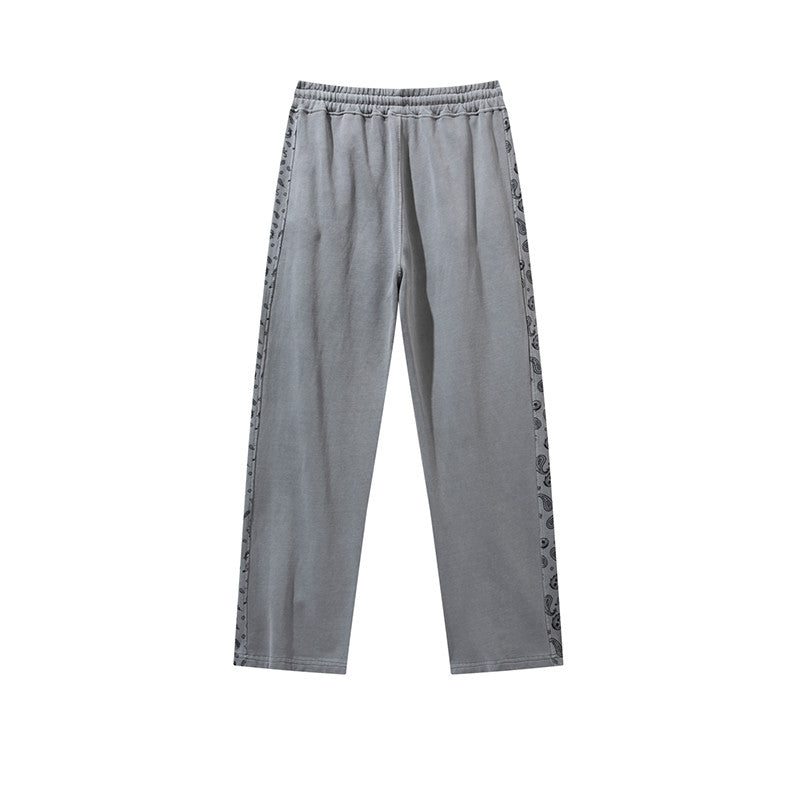 Pantalon à cordon de serrage, effet usé, coupe droite ample, style décontracté.