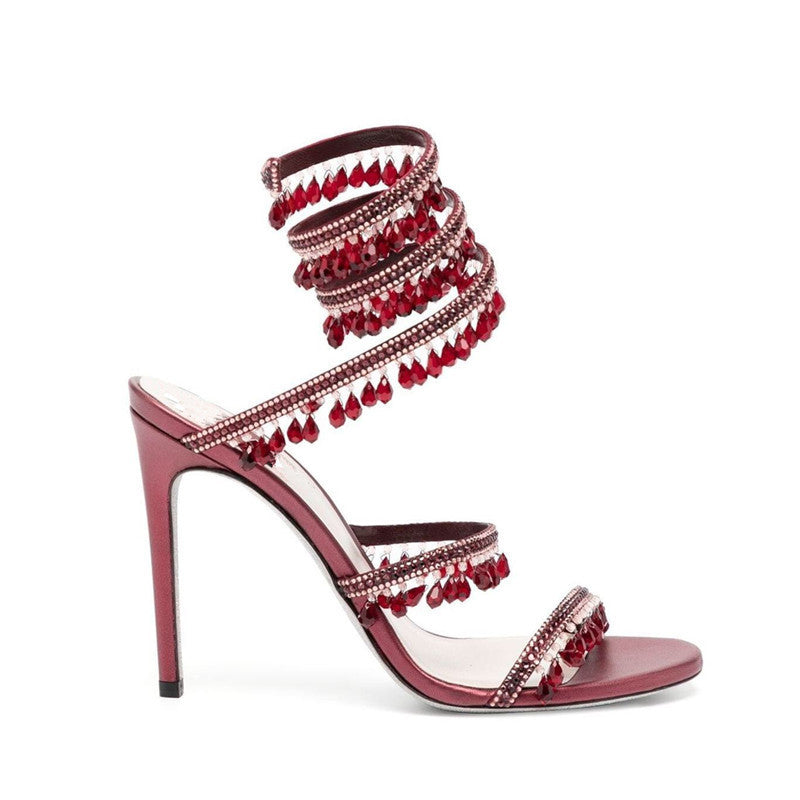 Sandales à lanières avec pendentif serpent en strass et pompons
