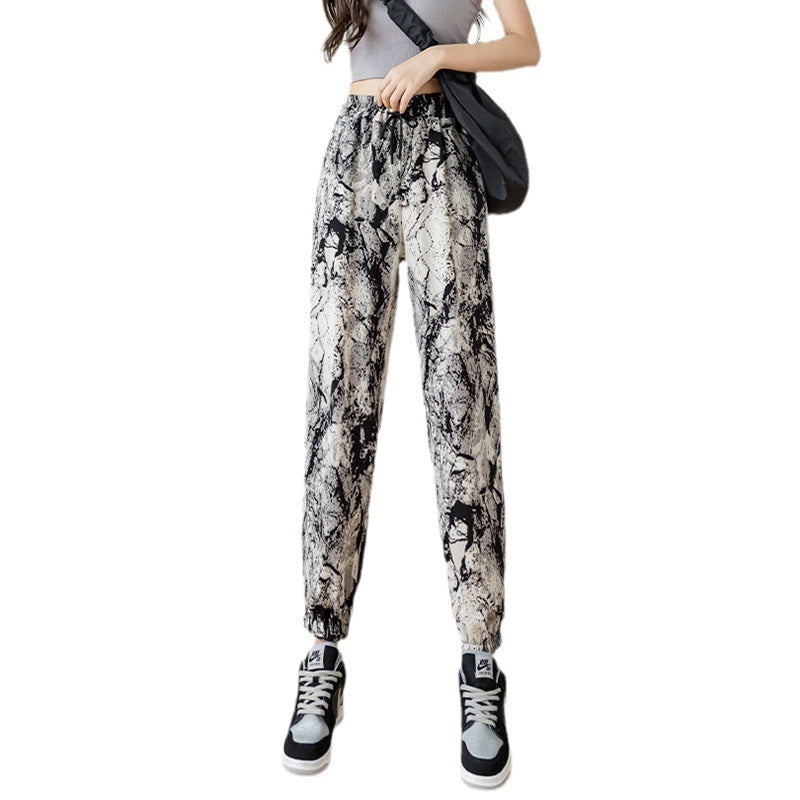Pantalon de jogging taille haute en soie glacée, motif peinture à l'encre tie-dye