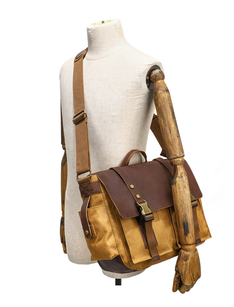 Sac bandoulière en toile cirée et cuir de vachette