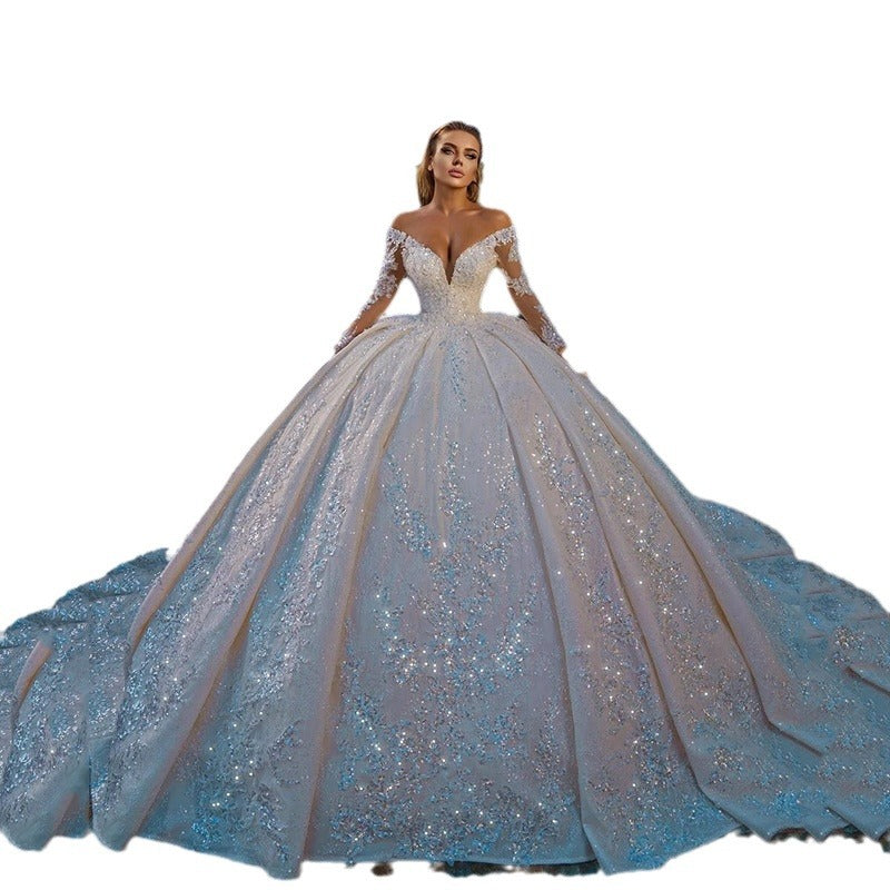 Robe de mariée longue brillante à paillettes et manches longues avec dos nu