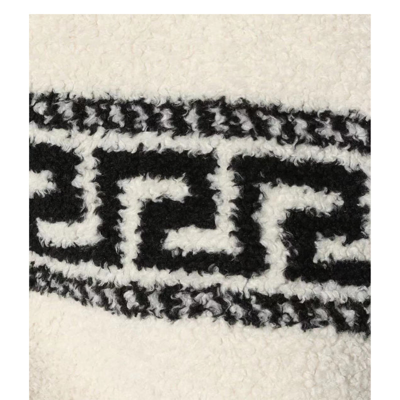 معطف صوفي فضفاض من صوف الحملان، بياقة عريضة وياقة قصيرة وسحاب قصير