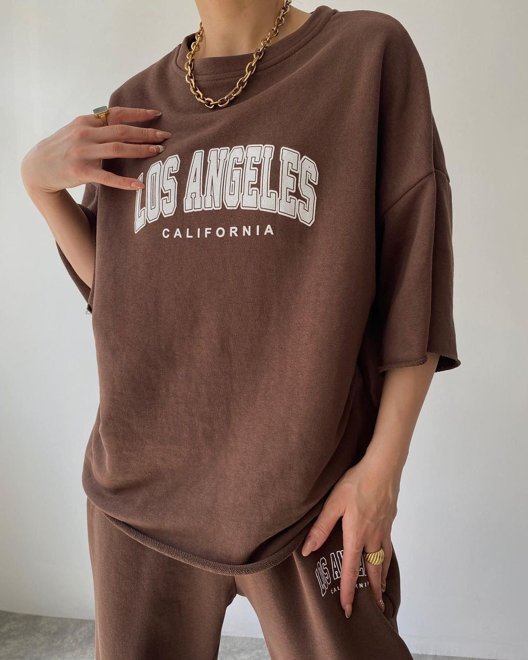 Ensemble deux pièces sweat à capuche imprimé manches courtes et pantalon pour femme