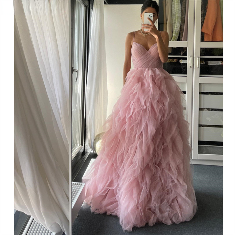 Robe longue de soirée/bal en maille rose avec bretelles fines et ourlet irrégulier