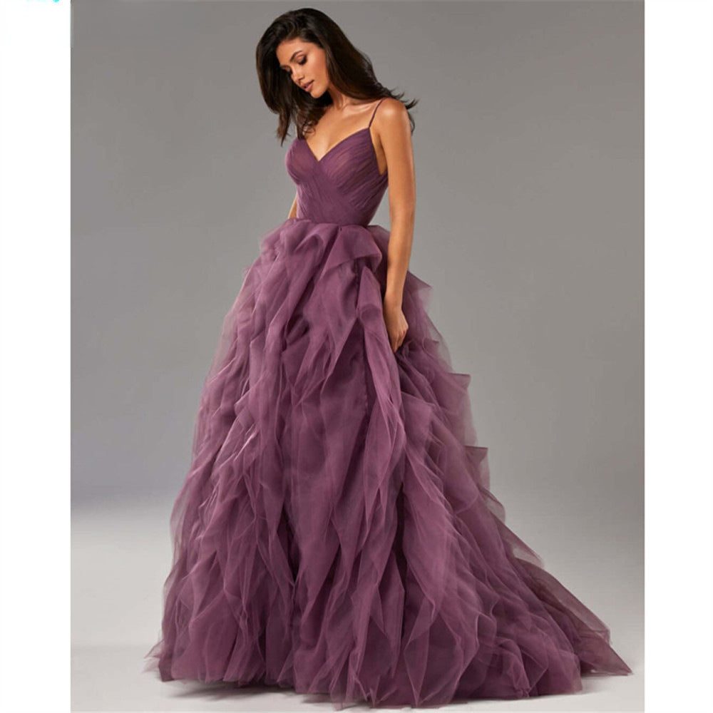 Robe longue de soirée/bal en maille rose avec bretelles fines et ourlet irrégulier